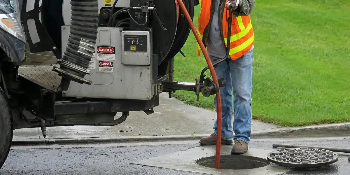 sewage clean up professionals using industrial equipment to remove contaminated wastewater in Arlington, TX